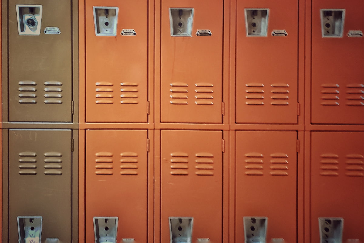 A series of brown and orange metal lockers