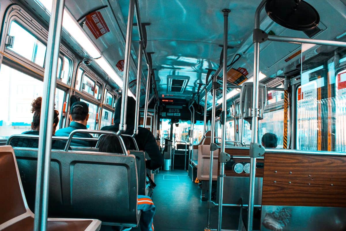 Interior view of a bus with a few passengers