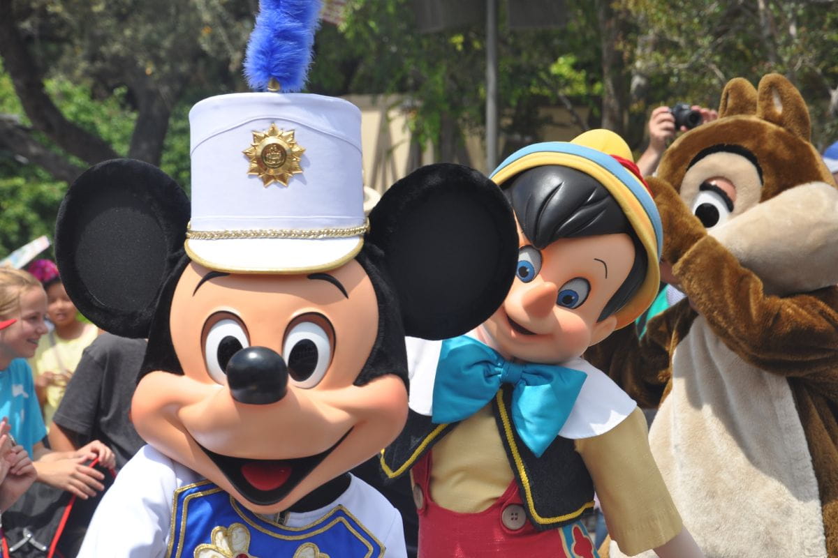 Disney character mascots doing meet-and-greets with fans
