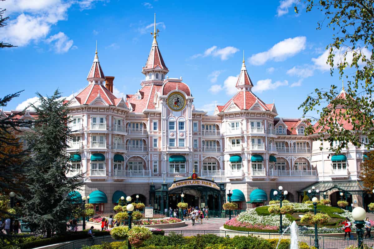 Wide view of the front of a hotel owned and operated by Disney
