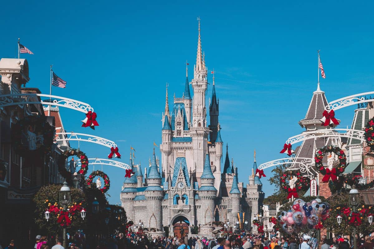 Panoramic view of crowded Disneyland with the castle in the middle