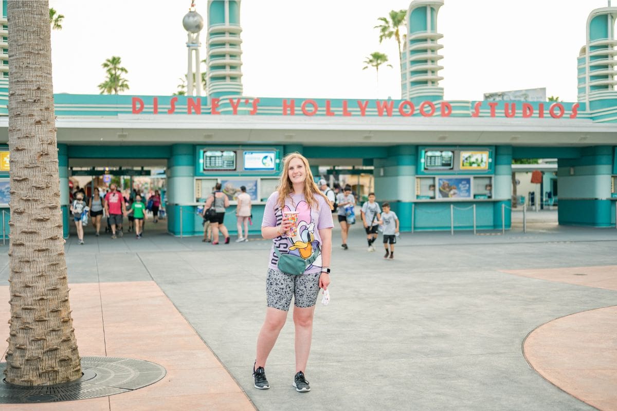 Woman standing in front of the entrance to Disney's Hollywood Studios