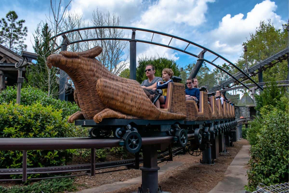 People riding the Flight of the Hippogriff roller coaster at Universal Orlando