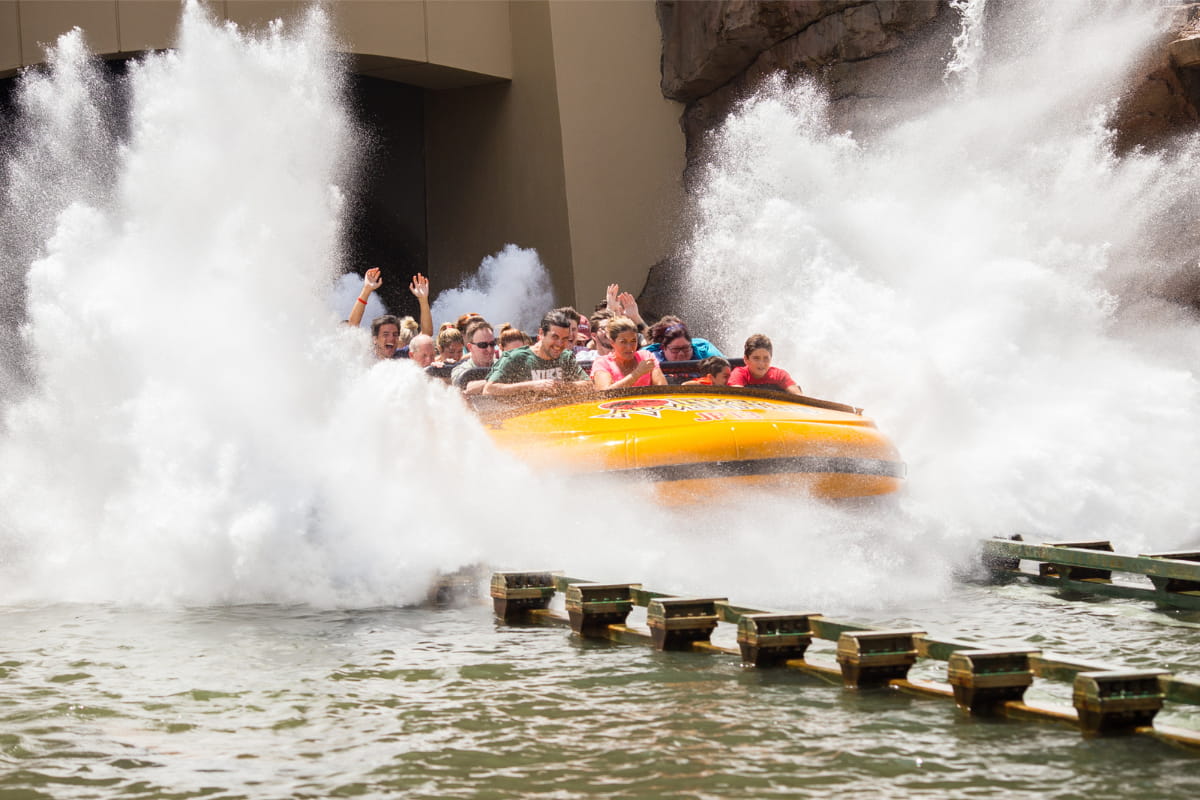 People riding the Jurassic Park River Adventure at Universal Islands of Adventure