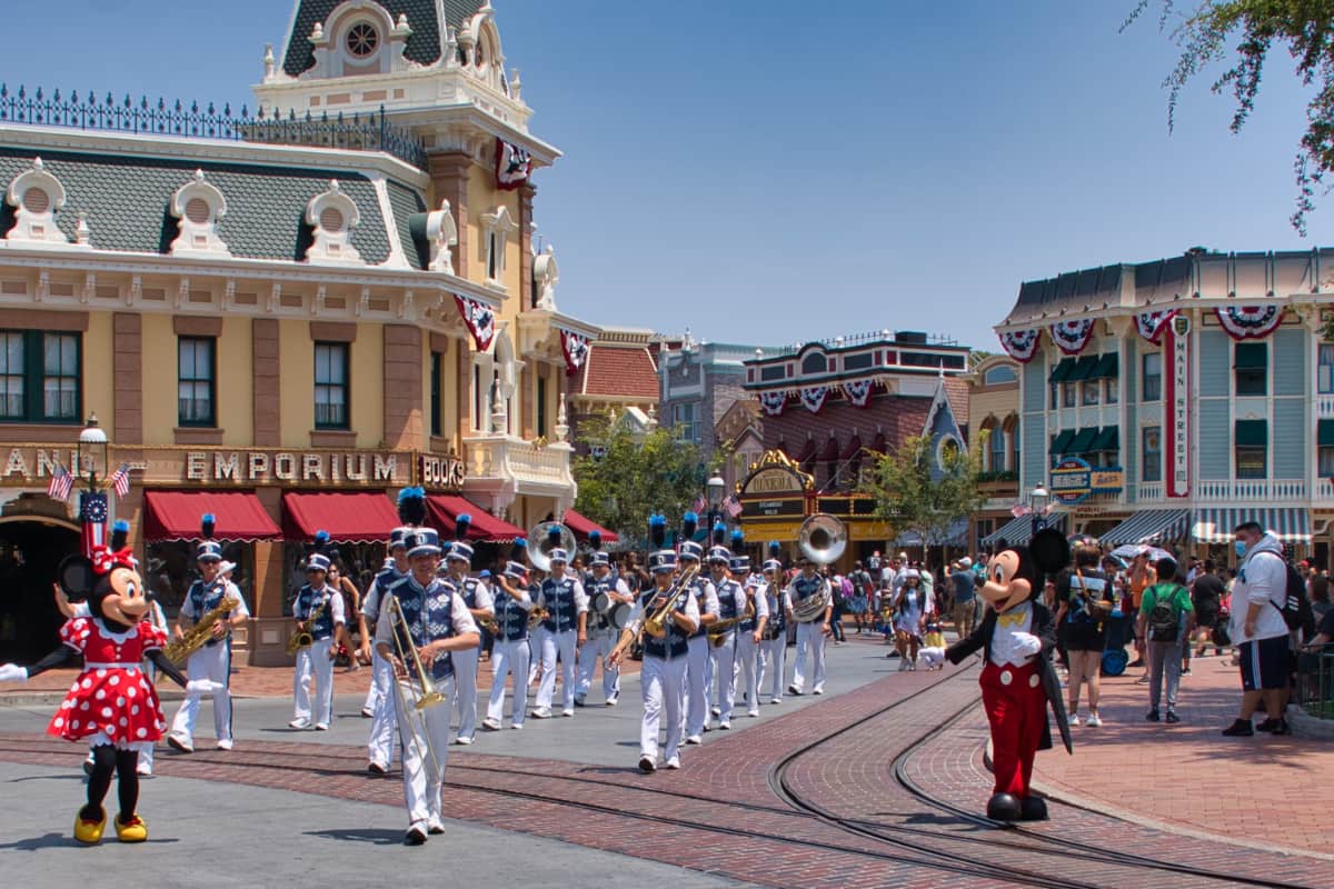 Mickey and Minnie Mouse leading a parade at Main Street USA at Disneyland