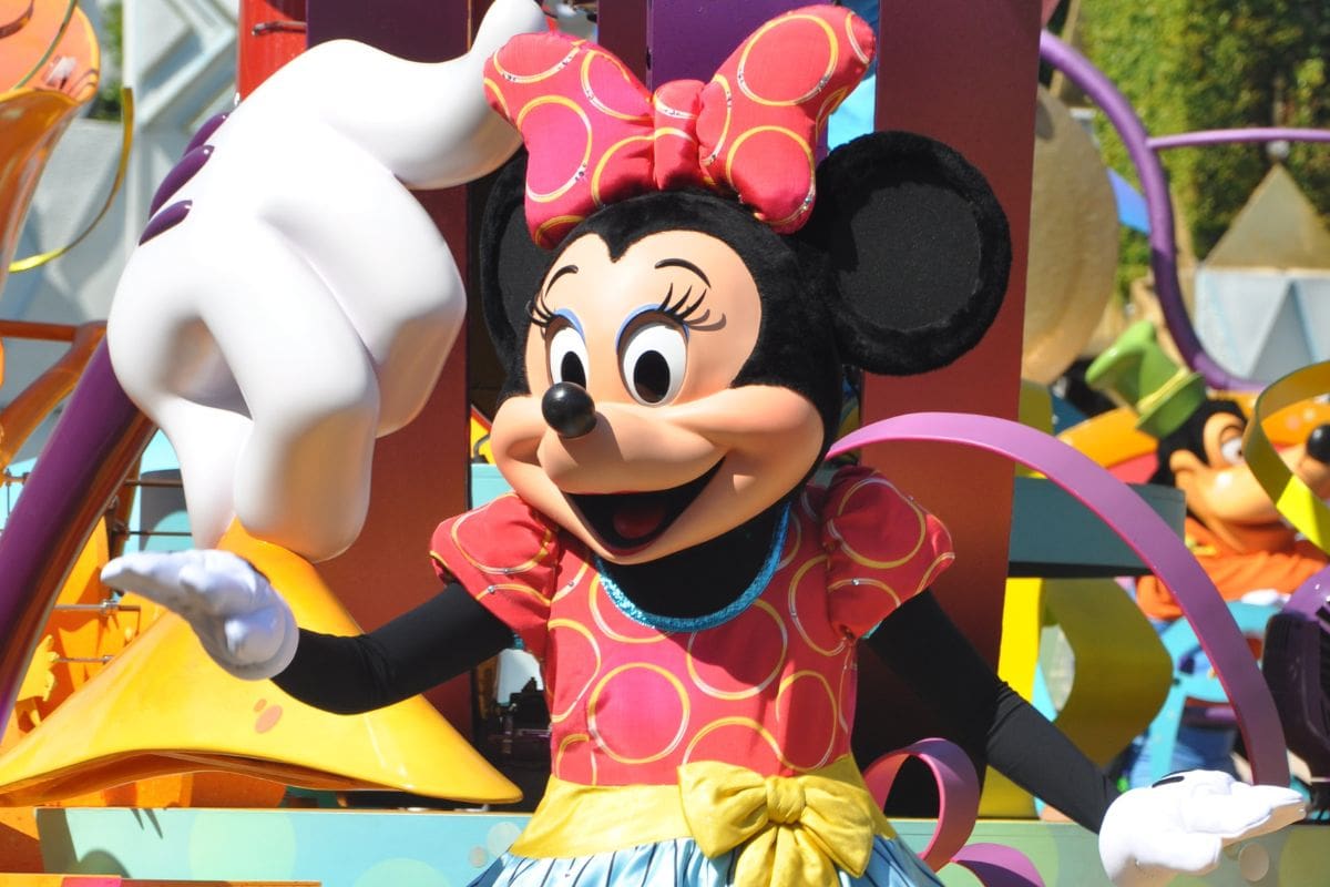 Person in Minnie Mouse costume performing at Disney World