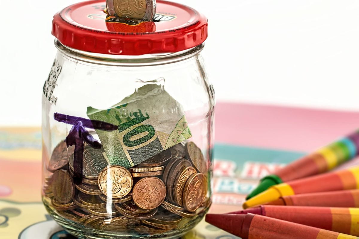 Coins and paper bills inside a jar