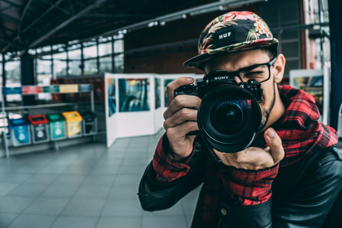 Man taking a photo using a DSLR camera