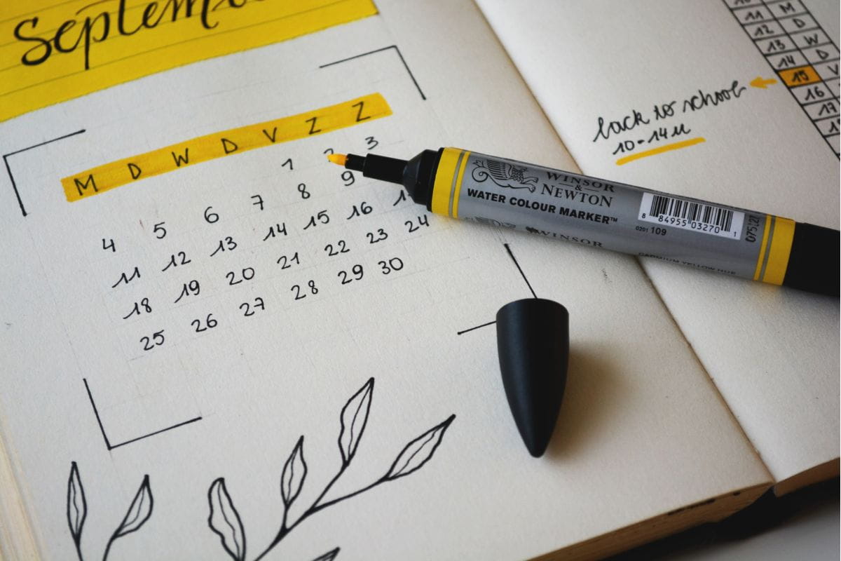 Yellow marker on a hand-written calendar showing the month of September