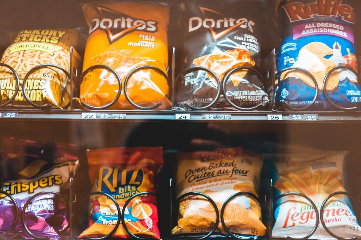 Assortment of packaged snacks inside a vending machine