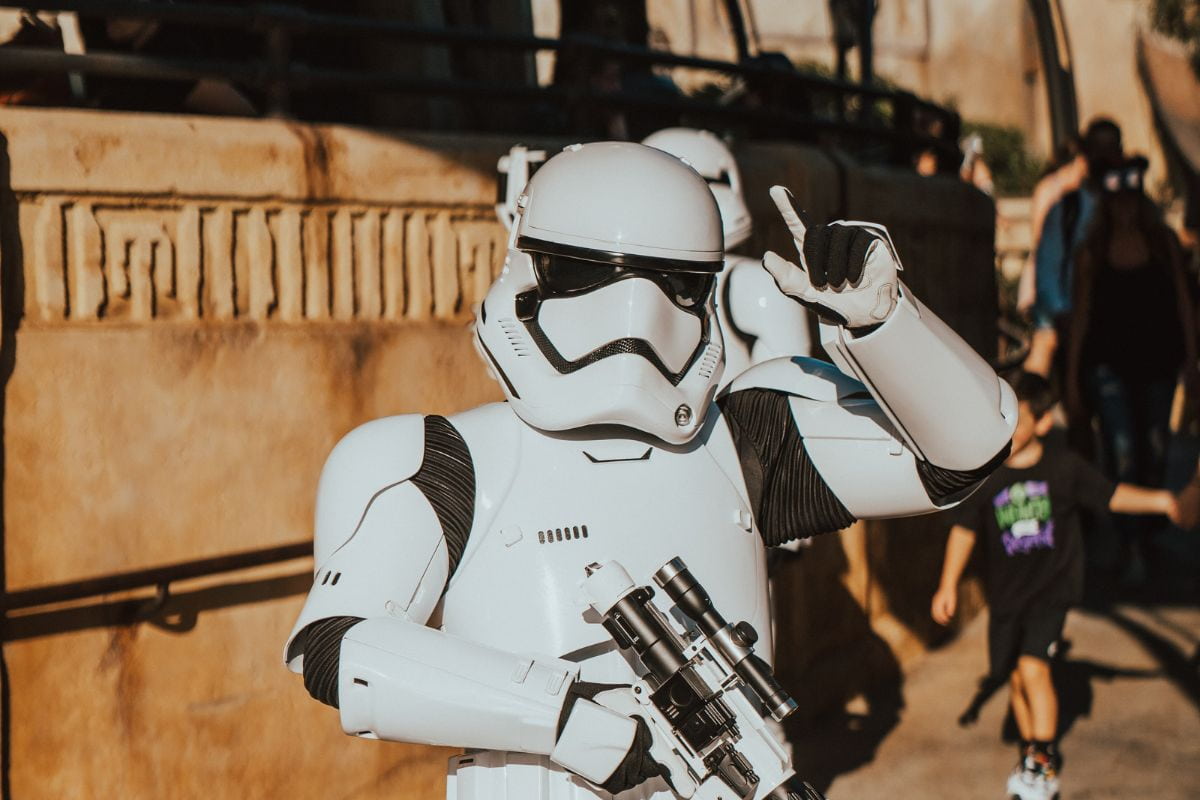 Person in a Stormtrooper costume greeting the person holding the camera