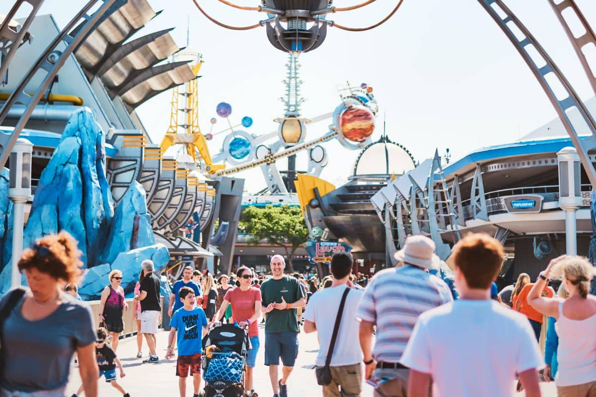 People entering and leaving Tomorrowland at Disney World Orlando