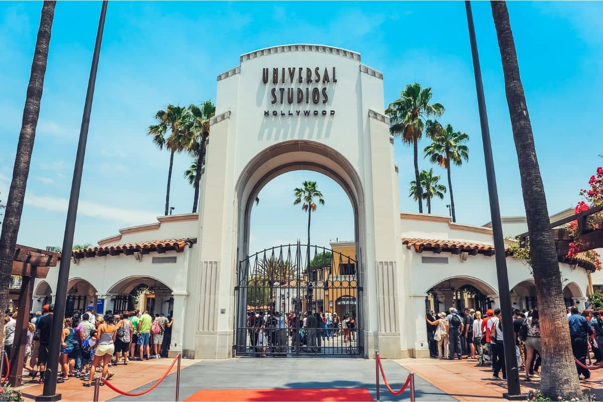 Universal Studios gate with people lining up at the ticket booths