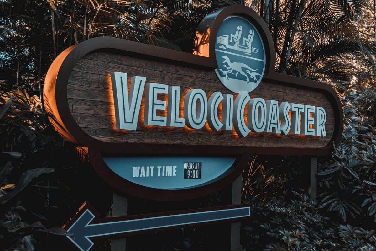 Sign for the VelociCoaster showing the direction of the ride as well as the wait time