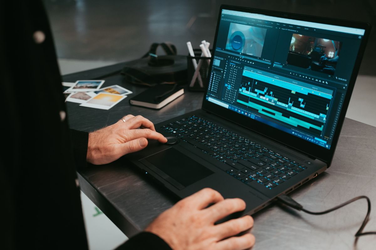 Person using a video editing software on a laptop