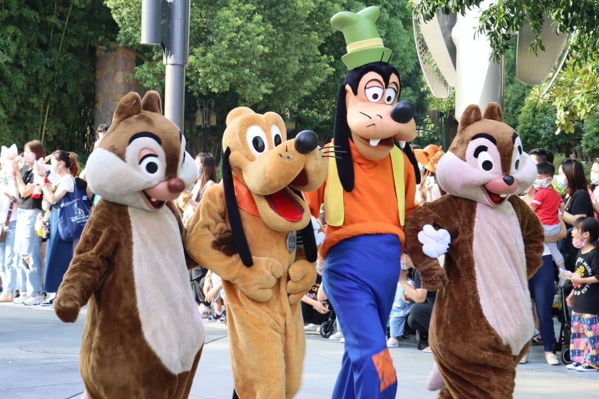 Four people dressed up as Disney characters performing at Disneyland