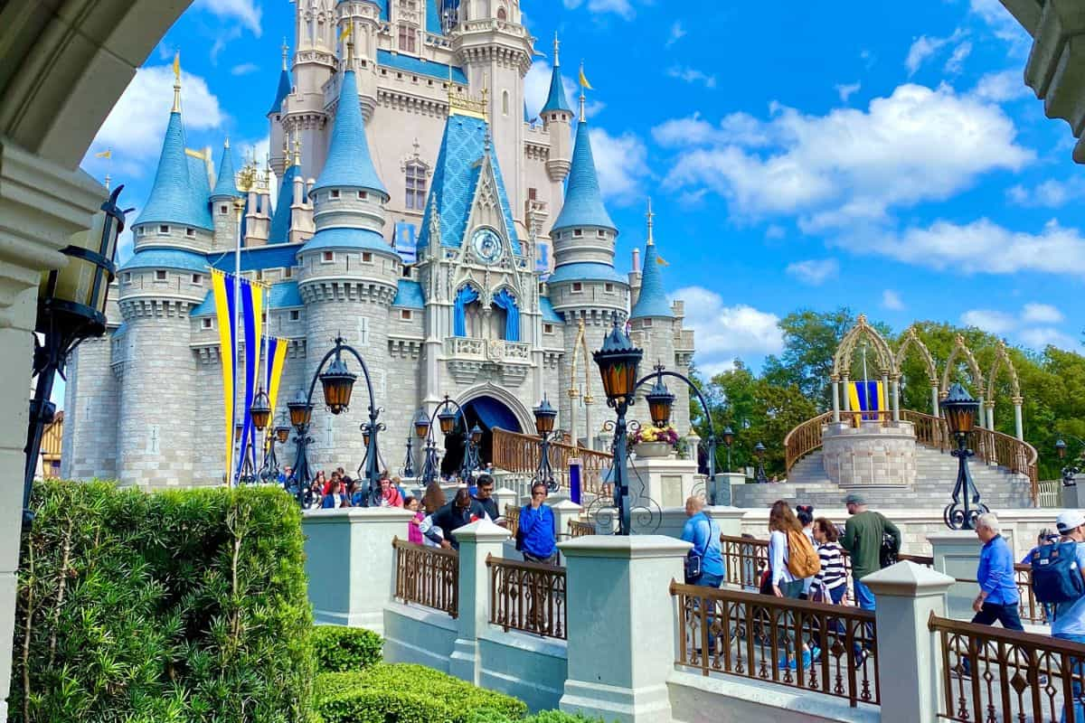 People walking towards the castle at Disney World