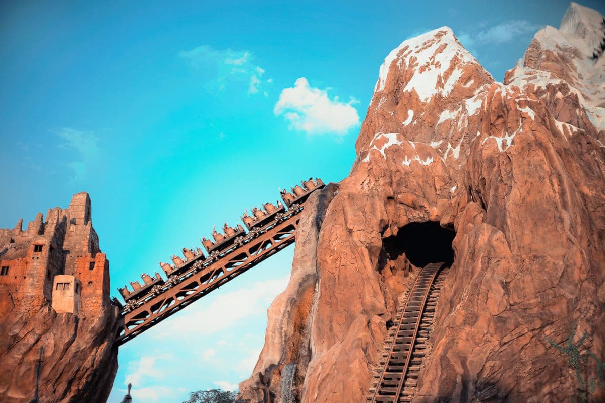 Roller coaster ascending the Big Thunder Mountain Railroad at Disney World Orlando