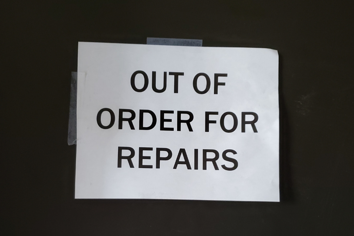 Black and white sign that says "OUT OF ORDER FOR REPAIRS"