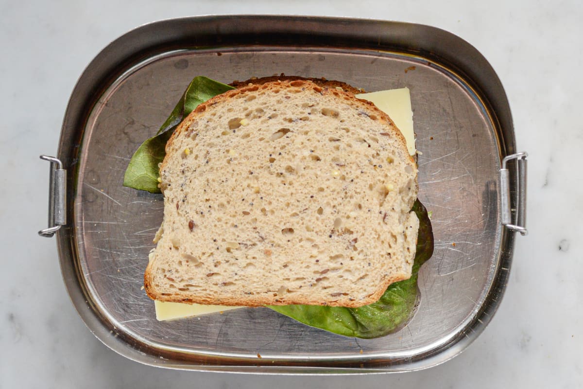 Sandwich inside a stainless steel lunchbox