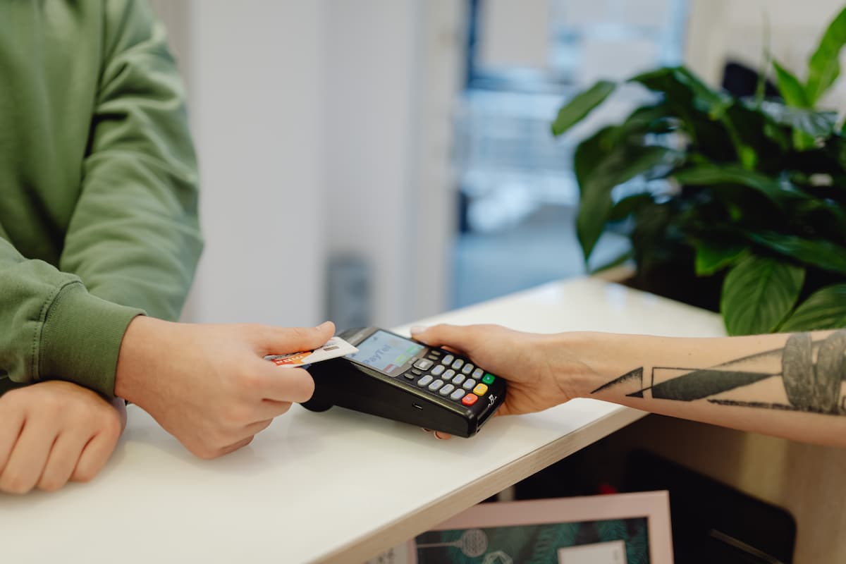 A person making a payment with a bank card.