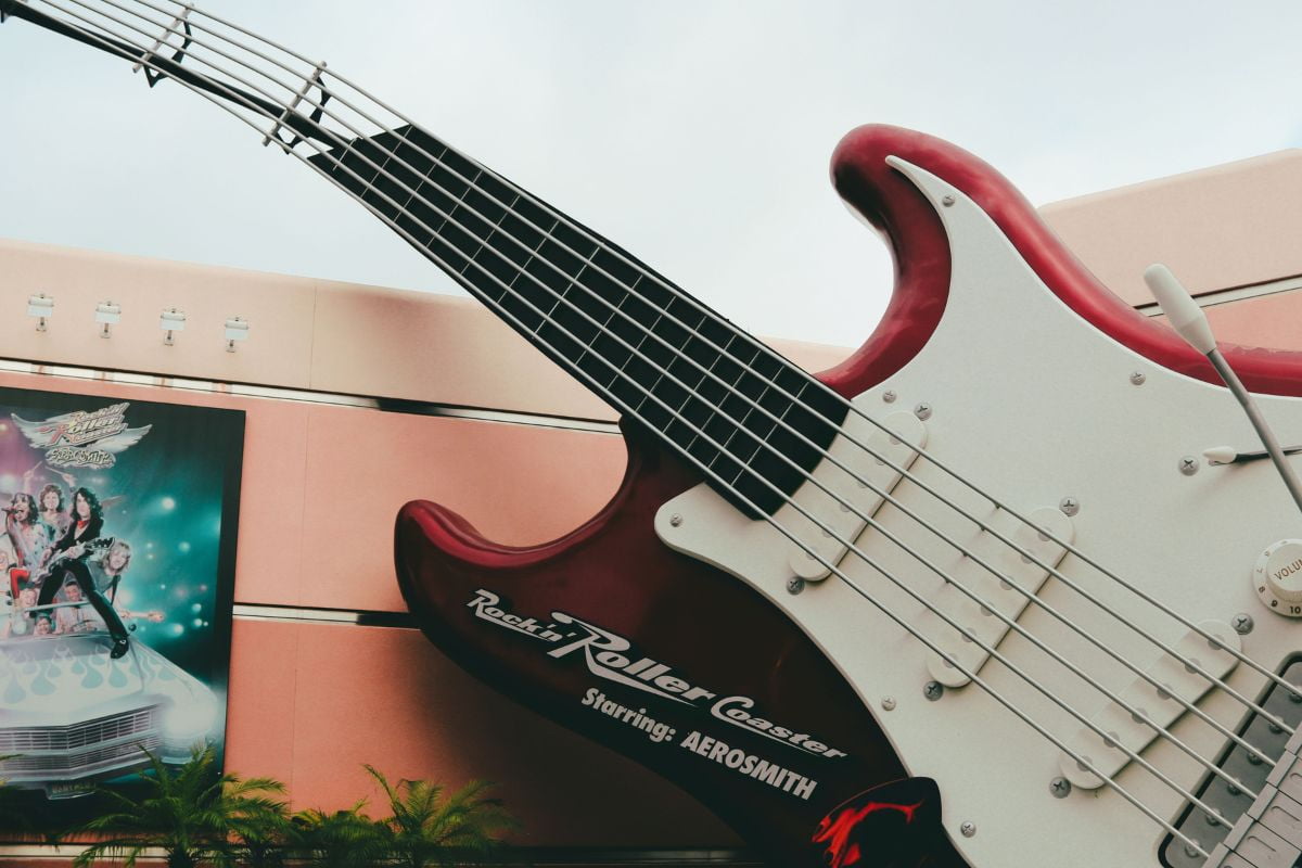 Gigantic red and white guitar at the entrance of the Rock n Roller Coaster ride at Disney World