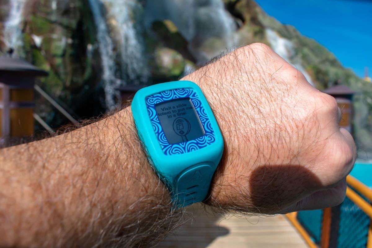 Close up of a person's arm wearing a blue TapuTapu bracelet