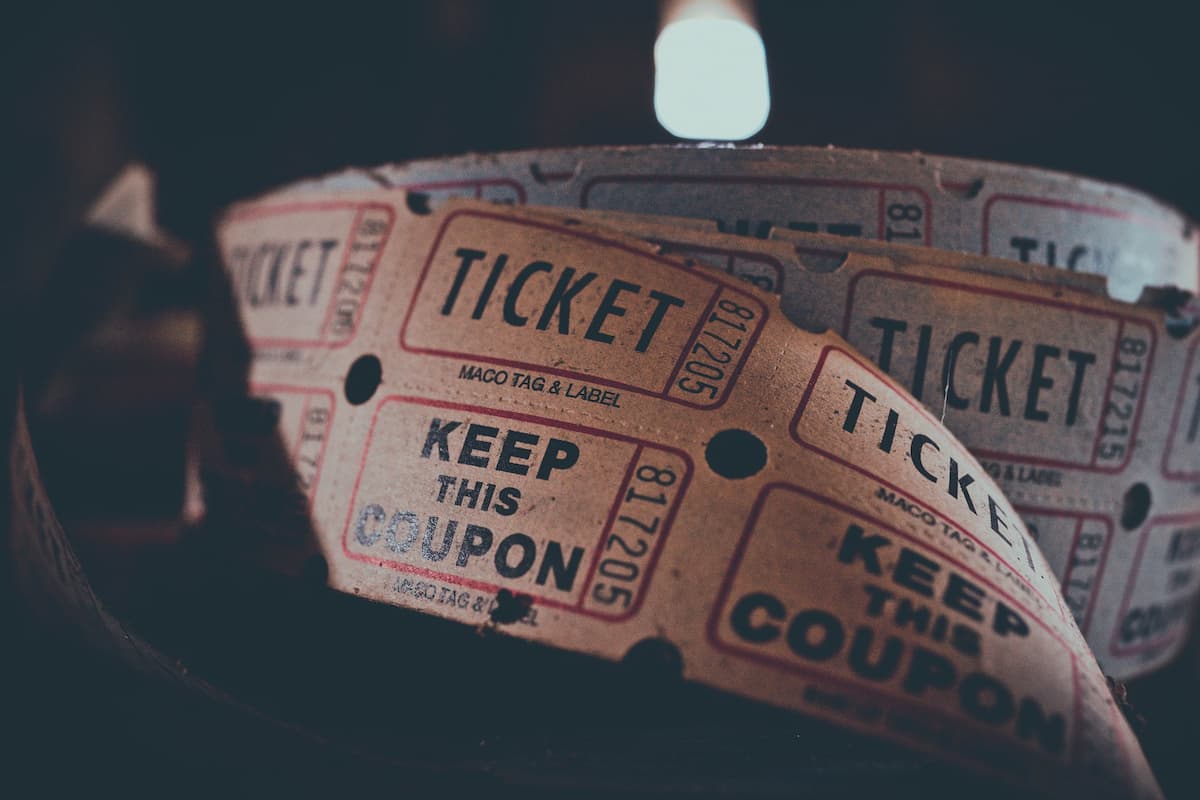 Close-up photo of tickets with a black background. 