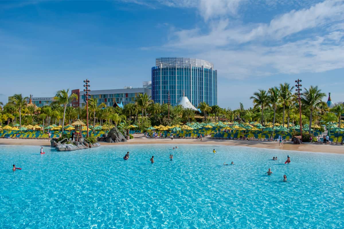Panoramic view of Waturi Beach with a few people swimming at Volcano Bay in Universal Orlando