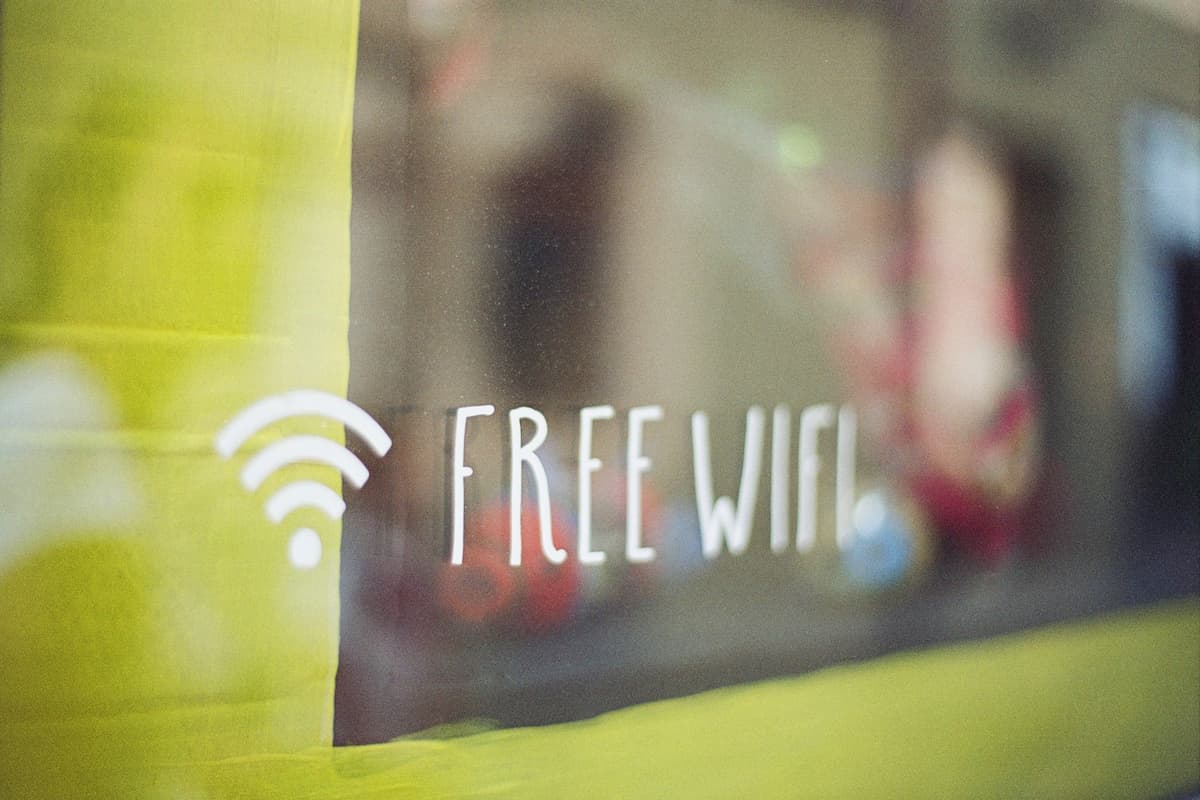 Close-up photo of a window with FREE WIFI labeled on it.