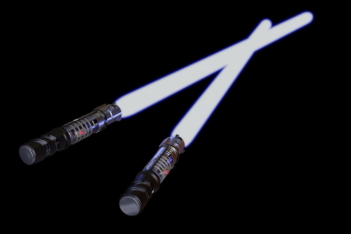 Two lightsabers on a black background.