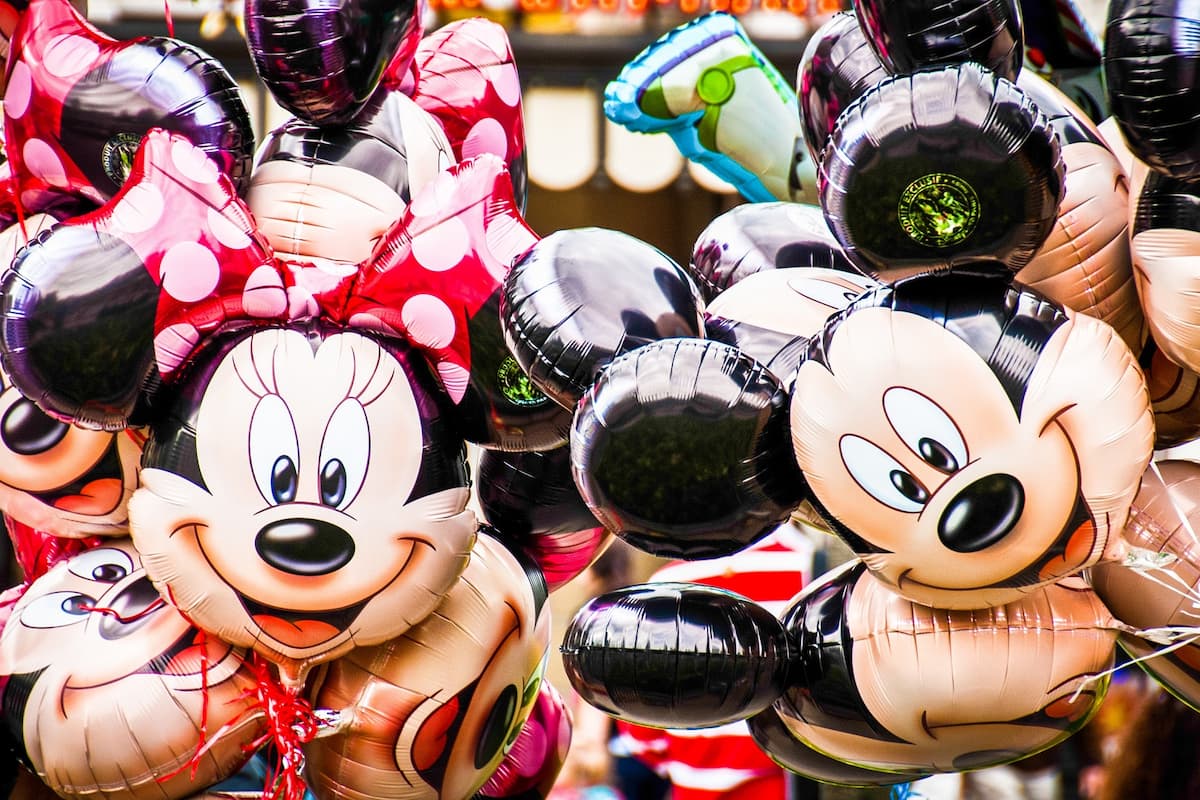 Close-up photo of Minnie Mouse and Mickey Mouse balloons.