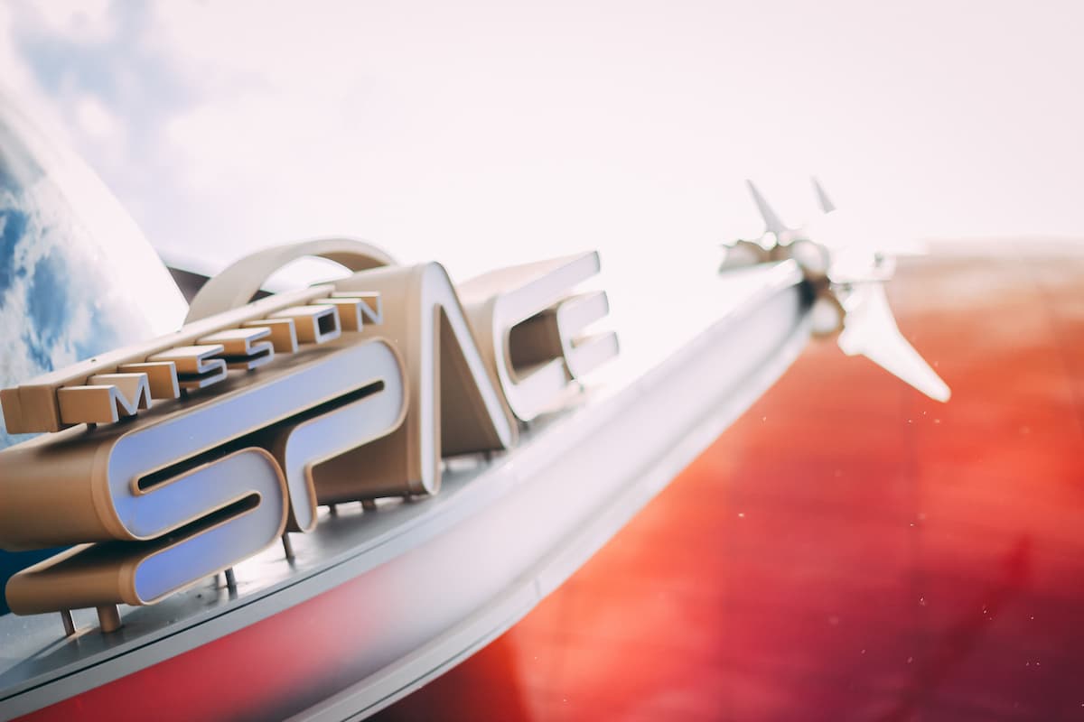 Mission: SPACE sign featuring a rocket ship.