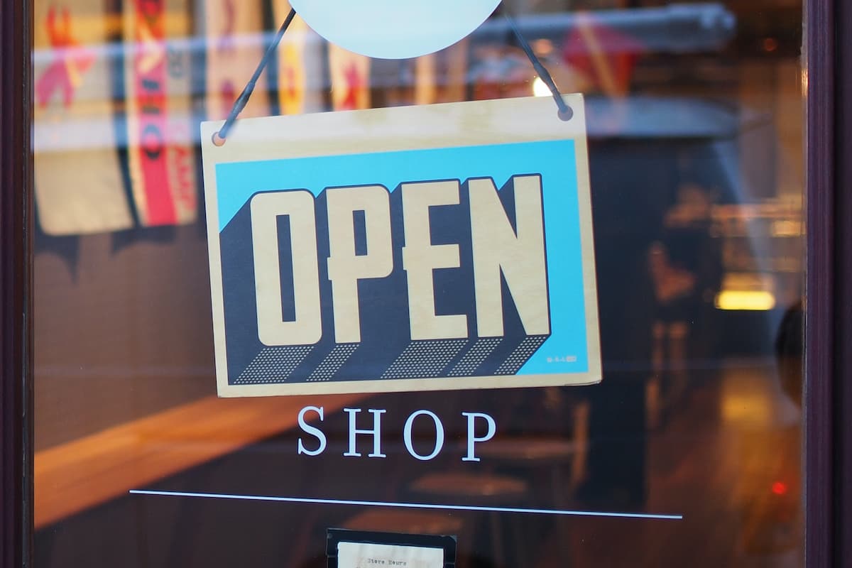 Open signage hung at the door of a store.