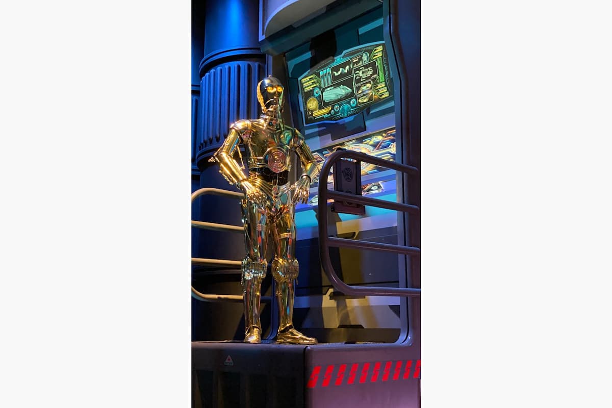 C-3PO standing in Star Tours at Disney World. 