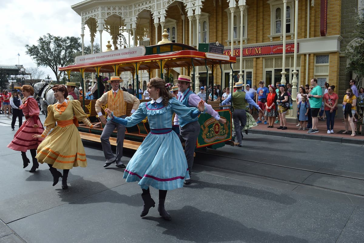 People dancing during a parade at Disney World.